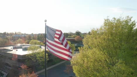 aerial of american flag in business park setting in usa