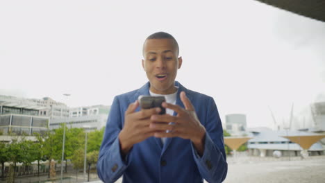 Smiling-young-man-having-video-call-through-phone-outdoor.