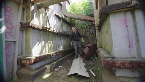 curious elderly man searching derelict dangerous construction design