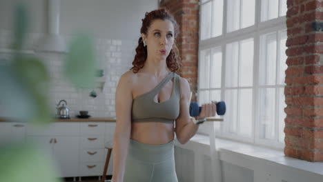 woman working out with dumbbells at home