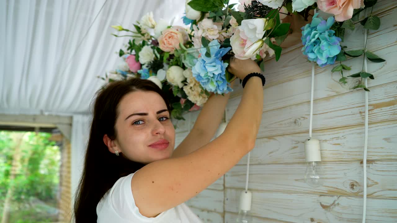 Closeup beautiful florist creating spring colorful bouquet arrangement