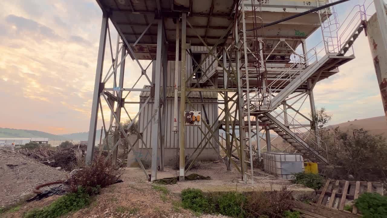 Forward view of electrical sockets at a disused production site. Day