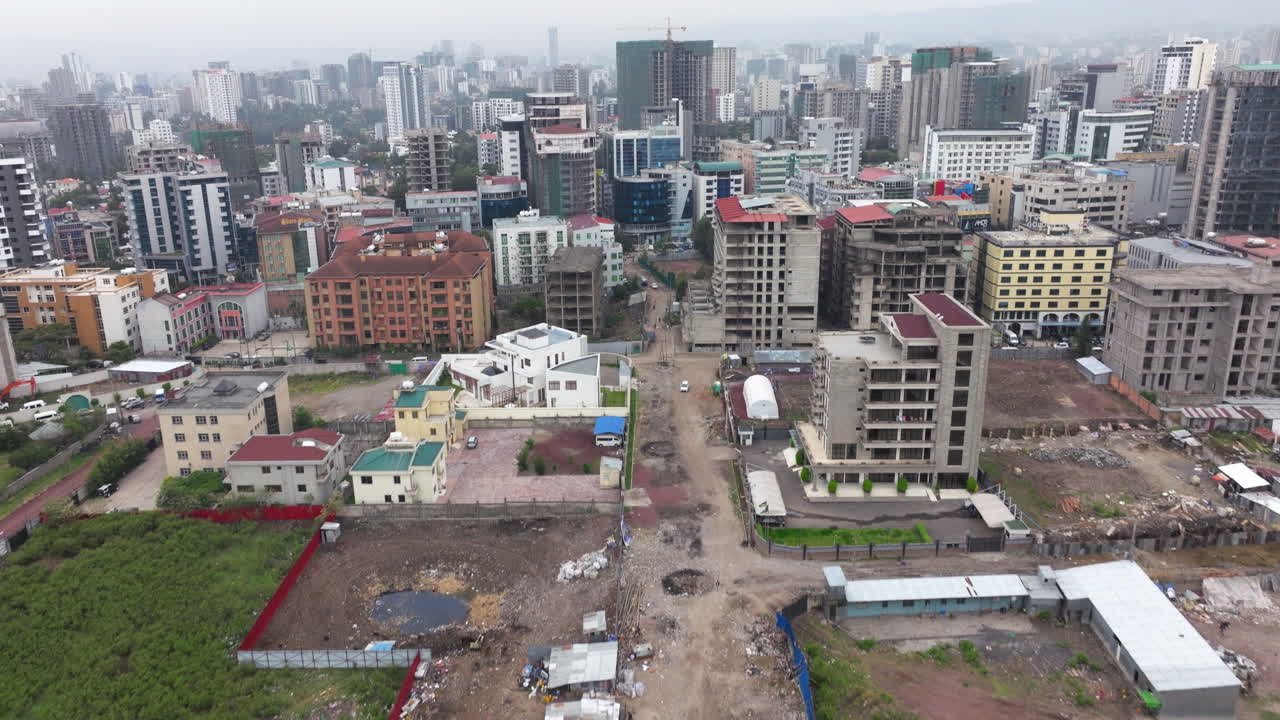 Building Construction Site On The City Of Bole Area In Addis Ababa District In Ethiopia. Aerial Tilt-up Shot