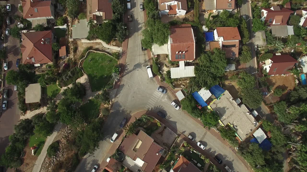 Aerial View of a Residential Neighborhood with Houses and Greenery