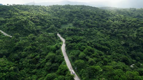 Road-Between-The-Green-Forest-In-The-Mountain-In-Baras,-Catanduanes,-Philippines