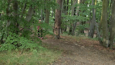 Young-Caucasian-man-walks-in-forest,-relaxing-outdoors