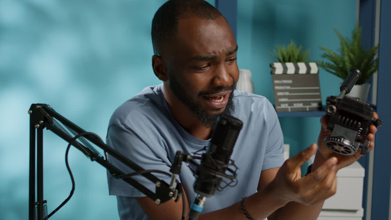 Social media vlogger reviewing tripod head for camera gear