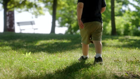 a child walking through the grass