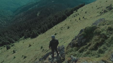 the man looks on the beautiful mountain landscape