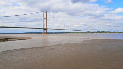 aerial footage of humber bridge, 12th largest single-span bridge globally, linking lincolnshire to humberside across river humber