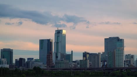 Scenery-Of-Towers-And-High-Rise-Buildings-With-Traffic-Over-Han-River-Seoul-Metropolitan-City,-Gangnam-Districts,-Korea