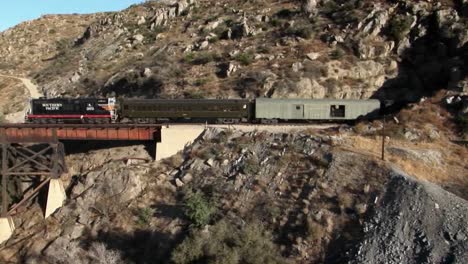 a freight train is traveling through a mountain tunnel