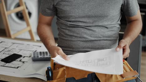 close up video of architect reviewing furniture designs