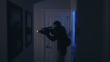 cinematic shot of a police raid with flashing lights and a swat officer entering house.