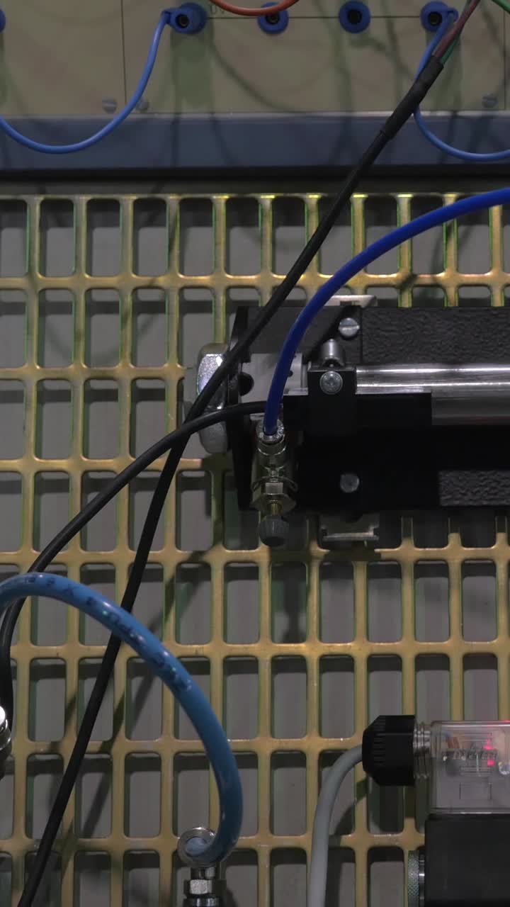 Pneumatic Cylinder Operating on an Industrial Control Panel