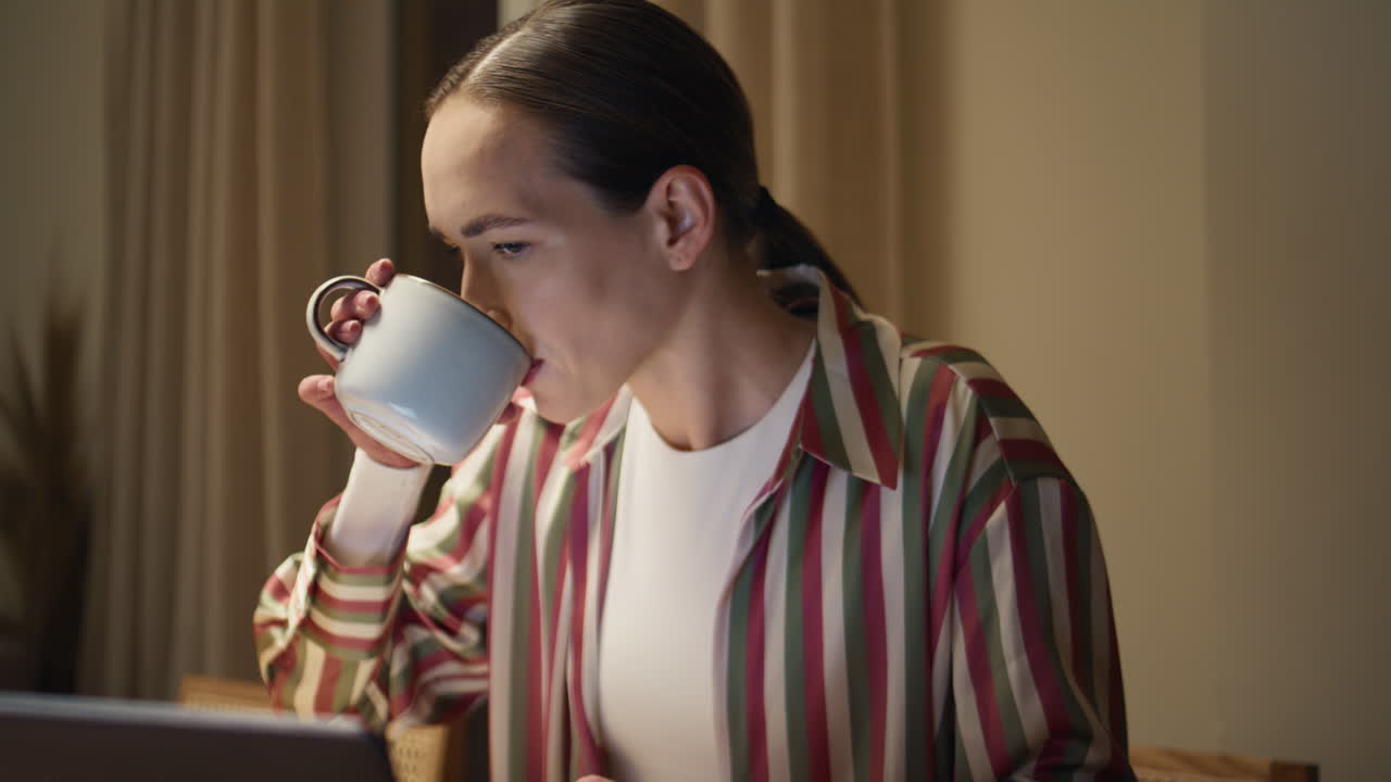 Closeup hands typing laptop in home office. Busy girl freelancer working night