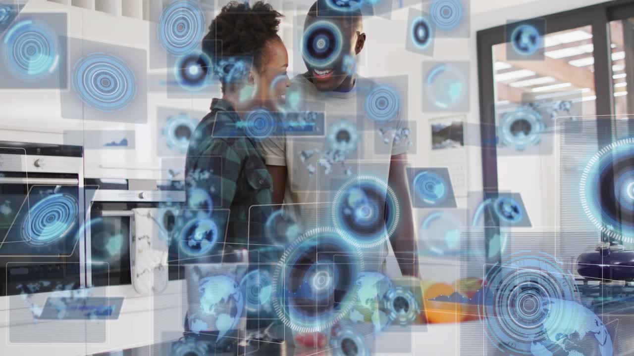 Man and woman chopping fruit for smoothie in kitchen, causing data icons appearing around them