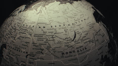 close-up view of a world globe focused on asia