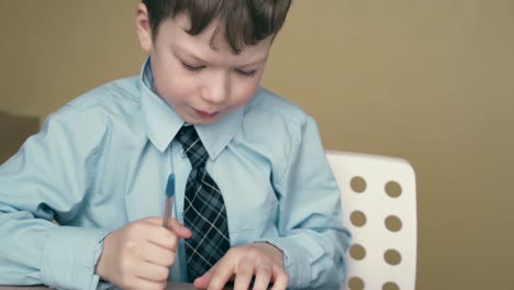 cu tracking schoolboy does homework writes a pen in a notebook uses a triangular ruler 2