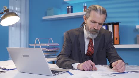 experienced senior mature businessman brainstorming on project in office.