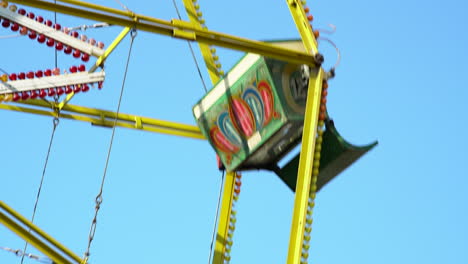 4k of a ferris wheel amusement ride buckets spinning at the fun fair