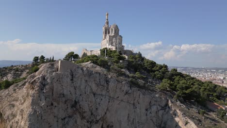 establishing drone shot of of basilica of notre-dame of la garde, marseille, france