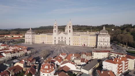 Aerial---Forward-approach-on-national-palace-of-mafra-on-sunny-day-in-portugal