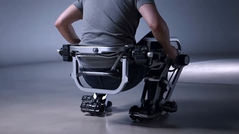 person demonstrating advanced lower-body exoskeleton technology