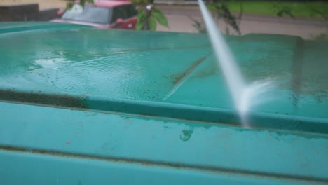 Pressure-washing-and-cleaning-dirt-off-van-roof