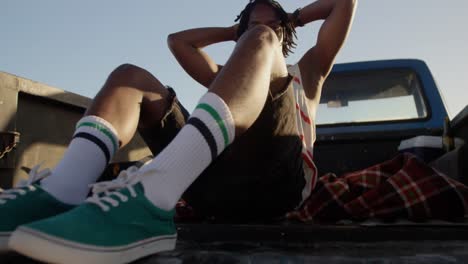 man relaxing in pickup truck at beach 4k