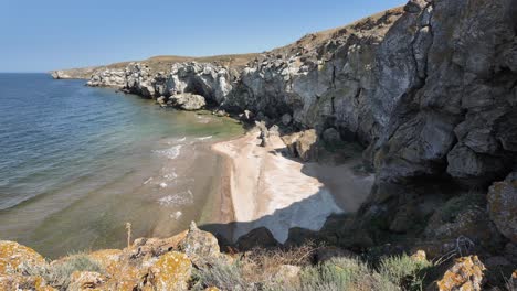 scenic view of a secluded rocky coastline with a small beach