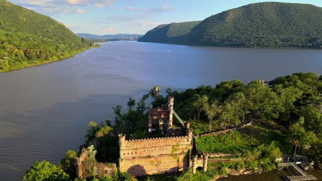 aerial drone footage of an abandoned castle on a small island