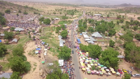 Rural-village-Market-in-Nigeria,-West-Africa---aerial-reveal