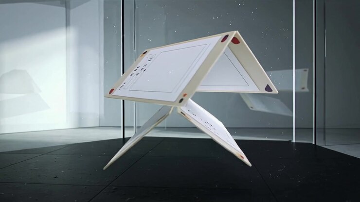 Magnetic lift engaging, levitating two-level printed cards rotating in glass chamber for exhibition
