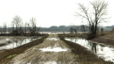 Wet-rainy-grey-winter-day,-rural-countryside-road,-wide-shot,-forward,-cloudy