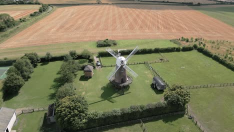 aerial view of wilton windmill and harvested fields in wilton, marlborough, united kingdom.
