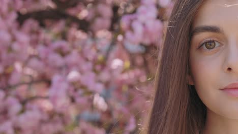 woman in cherry blossom garden