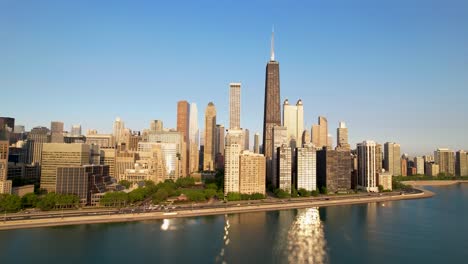 Chicago-City-Skyline-With-Morning-Sunbeams-Shinning-On-Lake-Michigan