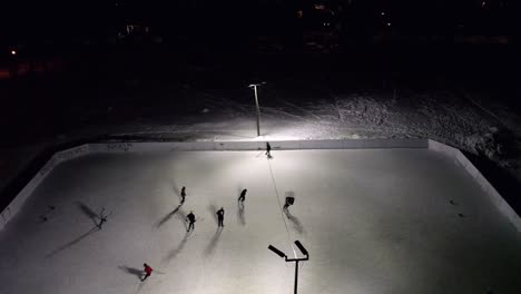 aerial shot of a hockey game in a montreal park