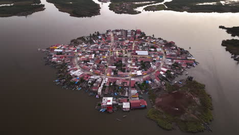 drone approaching the mexcaltitan village, colorful dusk in nayarit, mexico