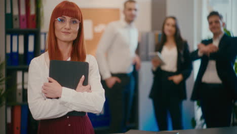 confident businesswoman with tablet pc in office.