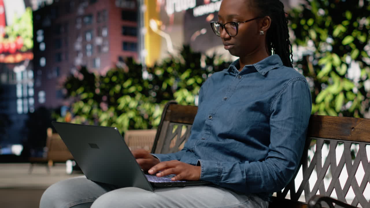 Turn off laptop, getting up from bench and leaving, woman finishing daily tasks