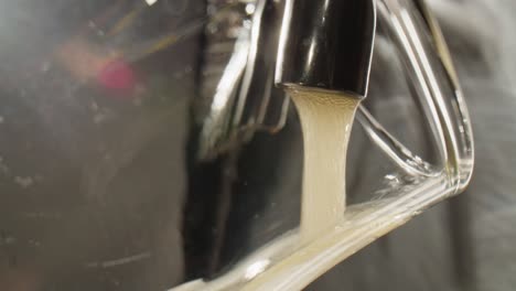 pouring beer into a glass