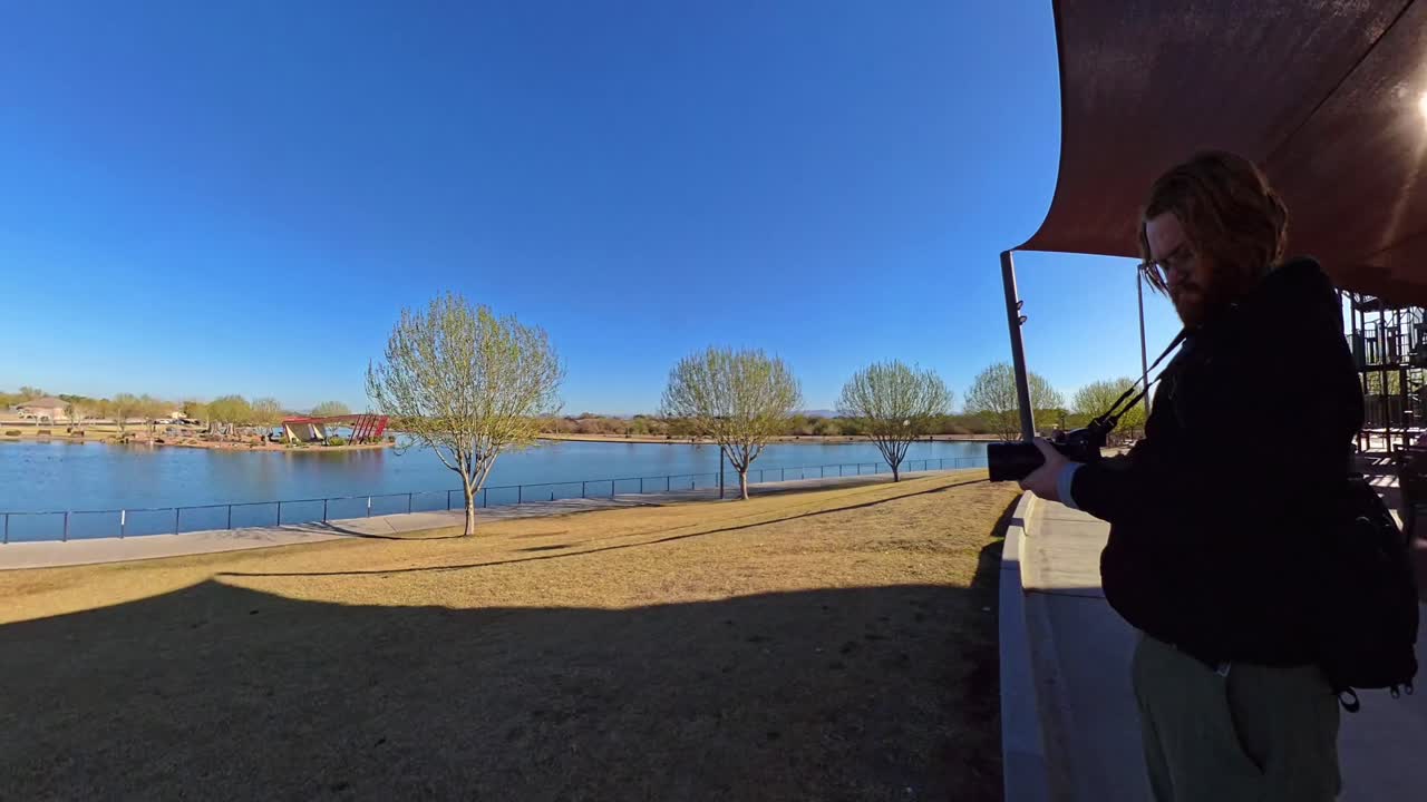 Red haired male taking pictures in Mansel Crater Park in Queen Creek Arizona.