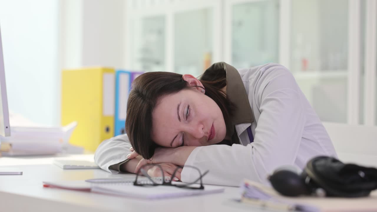 Exhausted Doctor Sleeping at Desk
