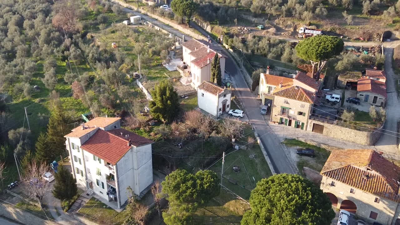 Aerial of Barocco stye 17th century Immacolata Concezione Casabiondo church near to the main villa  in the Florence surrounding hills. Winter season at sunset