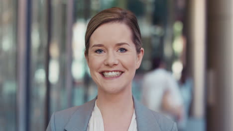 portrait of businesswoman outside corporate office building