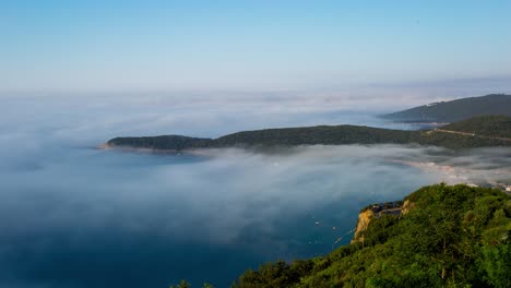 Timelapse-Of-Fog-Fading-Away-Above-The-Jaz-Beach-In-Budva,-Montenegro