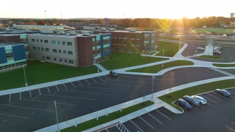 modern american high school during golden hour autumn sunset