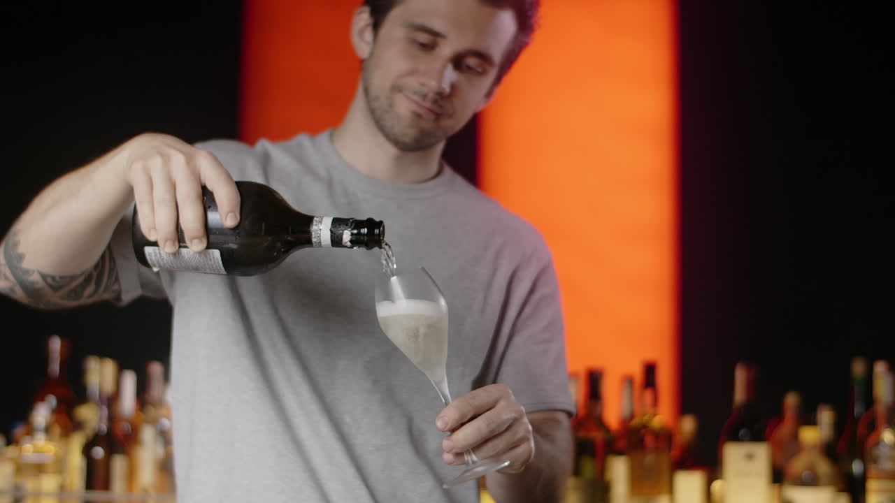 Bartender pouring champagne